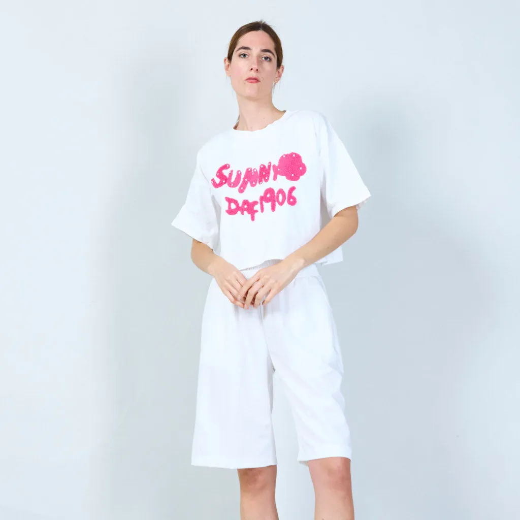 Fun cropped t-shirt with textured text design wholesale