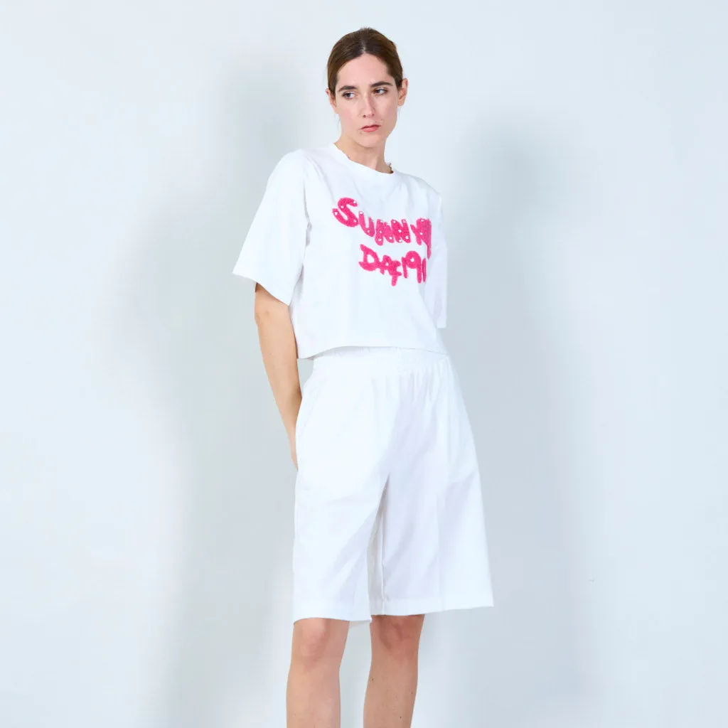 Fun cropped t-shirt with textured text design wholesale